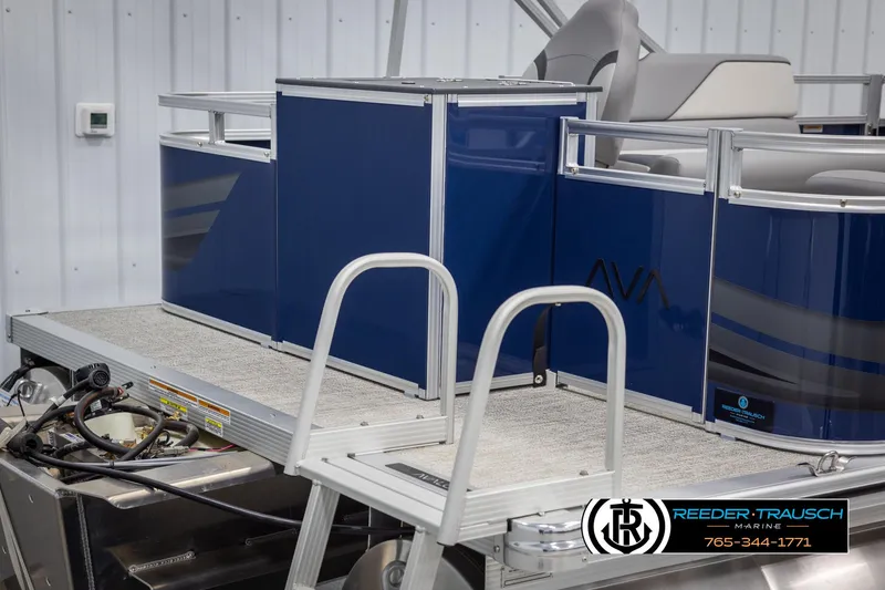 Slide: The Image of 2025 Avalon VEN RF pontoon boat with blue panels and silver railing in a showroom. - 45
