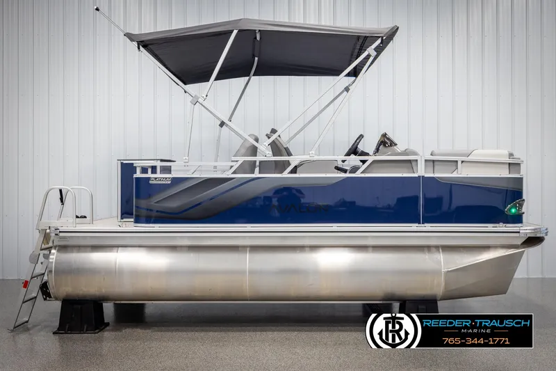 Slide: The Image of 2025 Avalon VEN RF pontoon boat with canopy, blue and silver design, side view. - 5