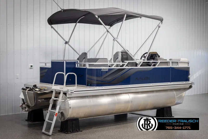 Slide: The Image of 2025 Avalon VEN RF pontoon boat with canopy in showroom, Reeder-Trausch Marine. - 6