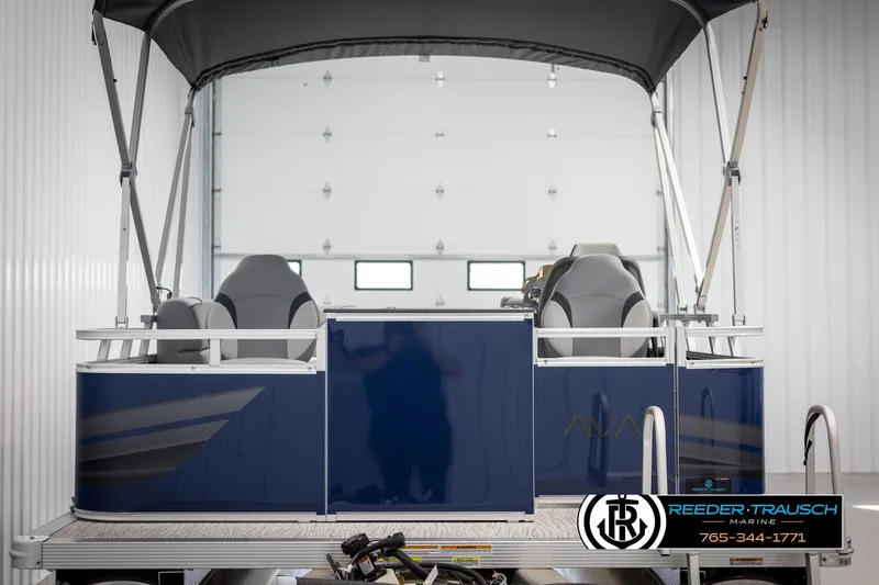 Slide: The Image of 2025 Avalon VEN RF pontoon boat with canopy in a showroom. - 7