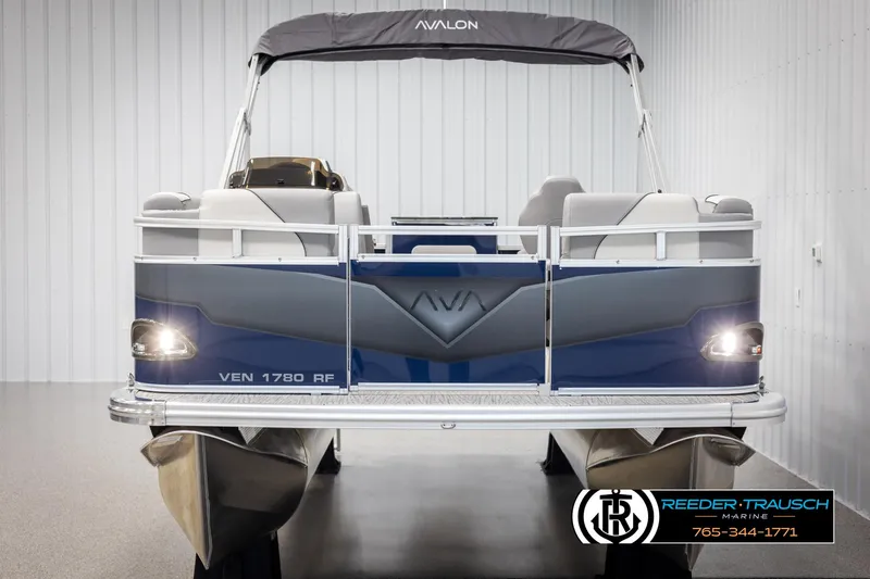 Slide: The Image of 2025 Avalon VEN RF pontoon boat in showroom, featuring sleek design and modern seating. - 8