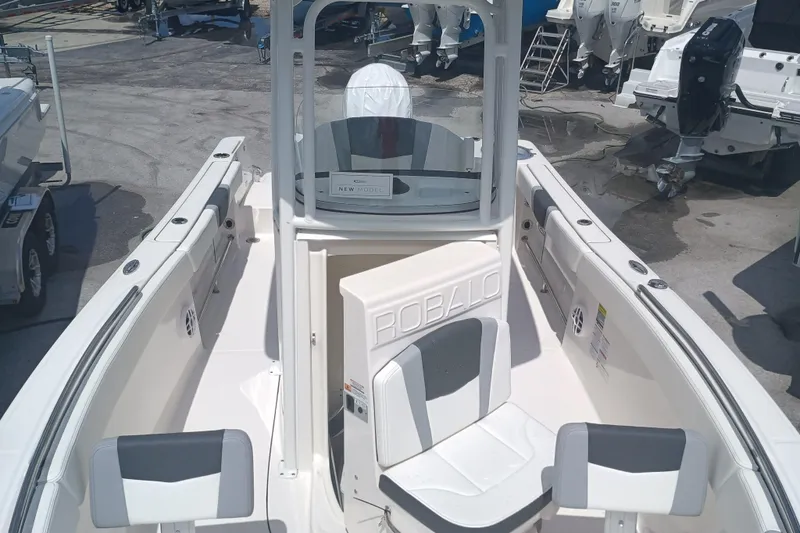 Slide: The Image of 2025 Robalo R230 Center Console boat with spacious seating and sleek design. - 18