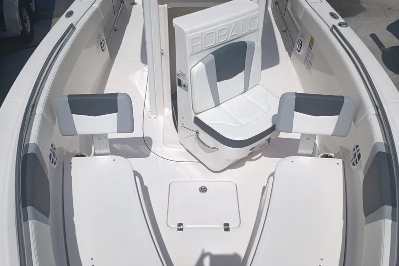 Slide: The Image of 2025 Robalo R230 Center Console boat interior with seating and storage. - 19