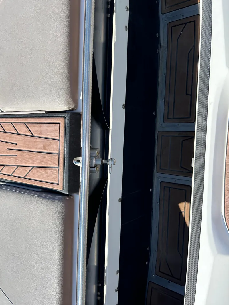 Slide: The Image of 2019 Centurion Fi21 boat interior with sleek seating and stylish flooring. - 10