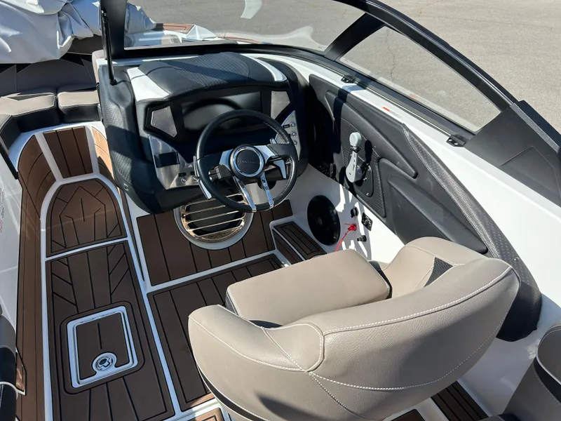 Slide: The Image of 2019 Centurion Fi21 boat interior with sleek dashboard and comfortable seating. - 7
