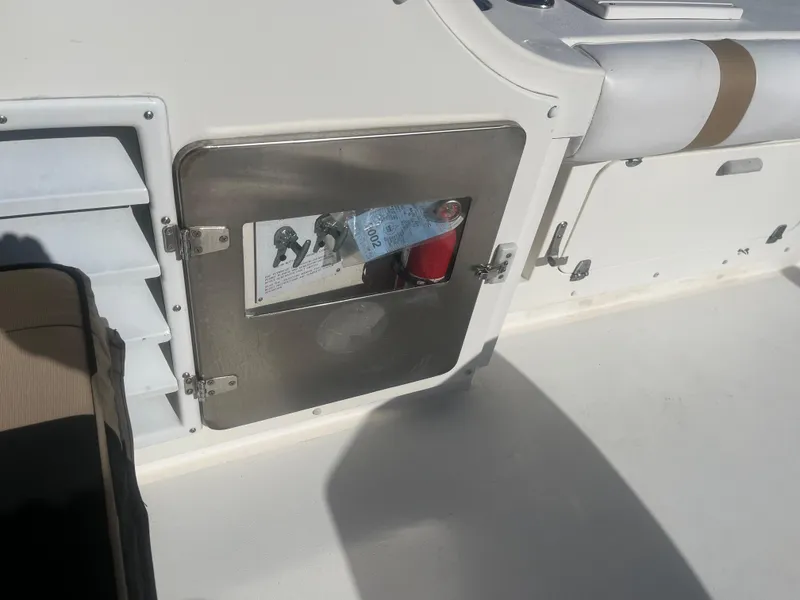 Slide: The Image of Storage compartment on a 1993 Bertram 37 Convertible boat deck. - 10
