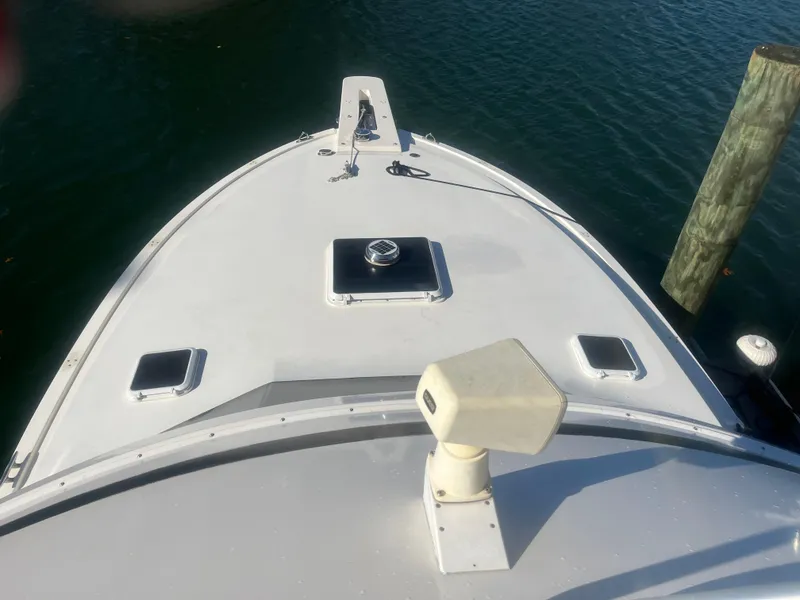 Slide: The Image of 1993 Bertram 37 Convertible boat deck view at dock. - 12