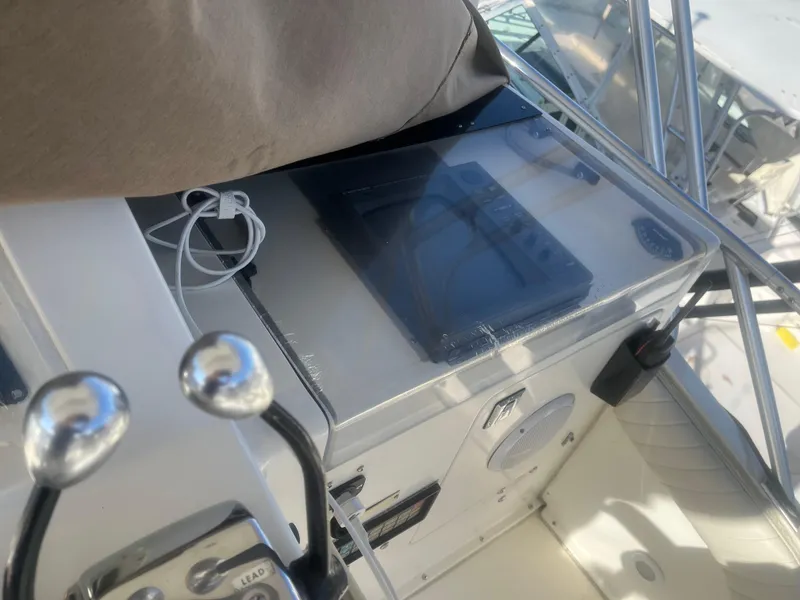 Slide: The Image of 1993 Bertram 37 Convertible boat cockpit with control panel and equipment. - 14