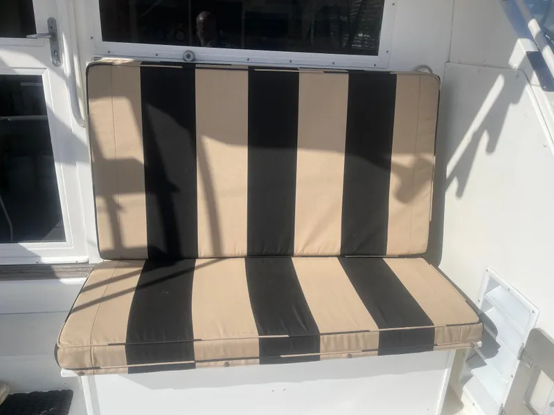 Slide: The Image of Striped seat cushion on a 1993 Bertram 37 Convertible boat. - 16