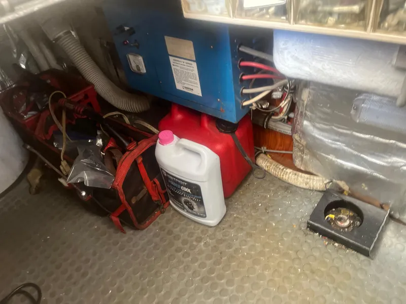 Slide: The Image of Engine room of 1993 Bertram 37 Convertible with tools and equipment. - 21