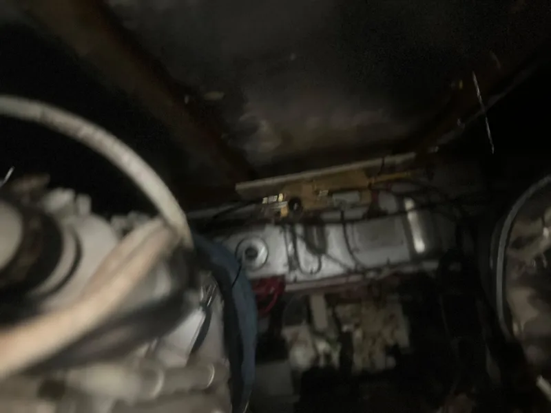 Slide: The Image of Engine room of a 1993 Bertram 37 Convertible boat, showing mechanical components. - 22