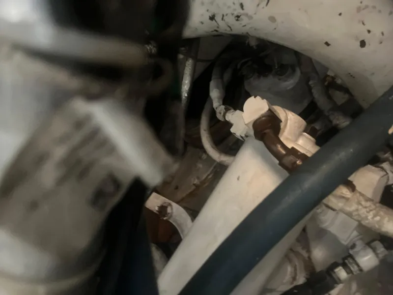 Slide: The Image of Close-up of engine components in a 1993 Bertram 37 Convertible boat. - 25