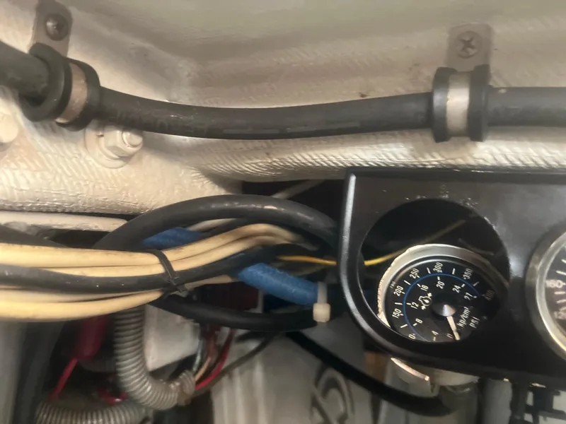 Slide: The Image of Close-up of 1993 Bertram 37 Convertible boat wiring and gauge panel. - 26