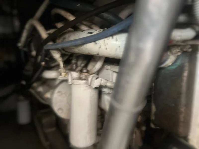 Slide: The Image of Engine components of a 1993 Bertram 37 Convertible boat. - 27