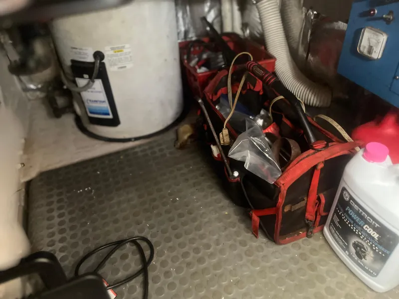 Slide: The Image of Engine room of 1993 Bertram 37 Convertible with tools and equipment. - 28