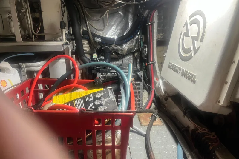 Slide: The Image of Engine room of 1993 Bertram 37 Convertible with Detroit Diesel components and maintenance tools. - 43