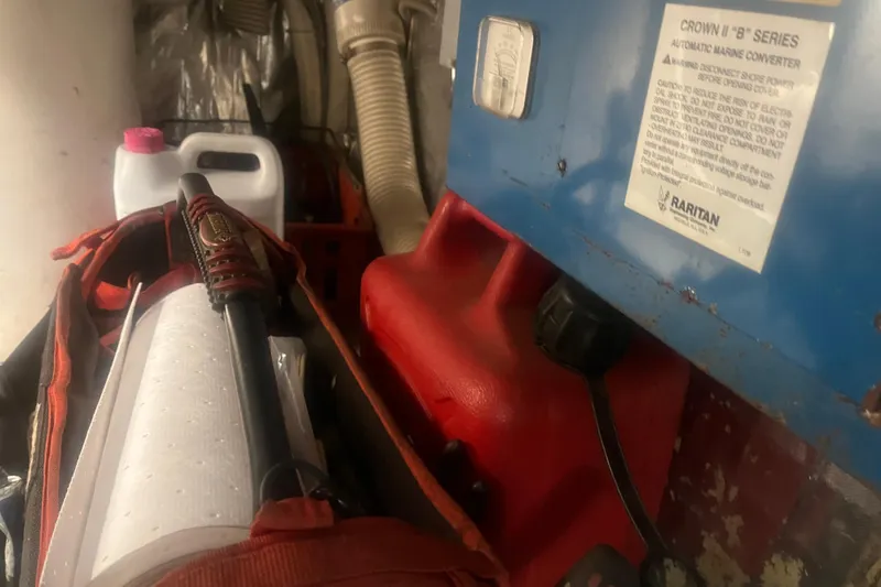 Slide: The Image of Engine room of 1993 Bertram 37 Convertible with marine equipment and supplies. - 47