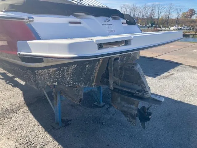 Slide: The Image of 2008 Regal 1900 Bowrider boat on stands, showing stern and outdrive. - 2
