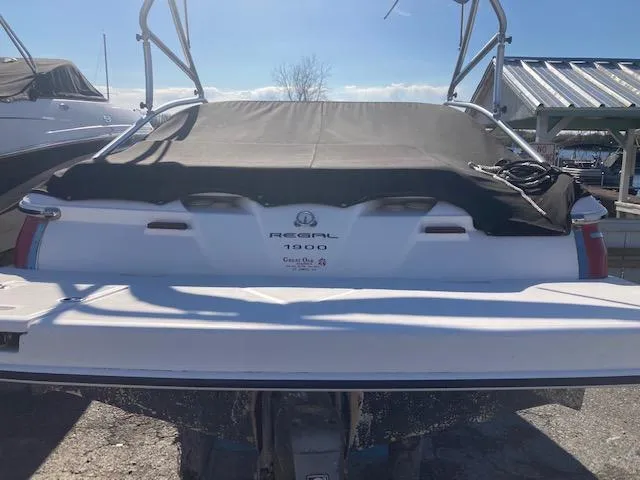 Slide: The Image of 2008 Regal 1900 Bowrider boat with cover, docked at marina. - 4