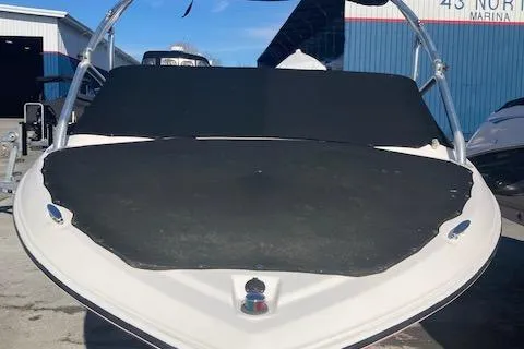 Slide: The Image of 2008 Regal 1900 Bowrider boat with black cover at marina. - 5