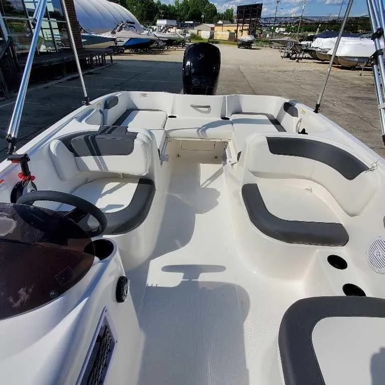 Slide: The Image of 2025 Bayliner E18 boat interior with spacious seating and modern design. - 8