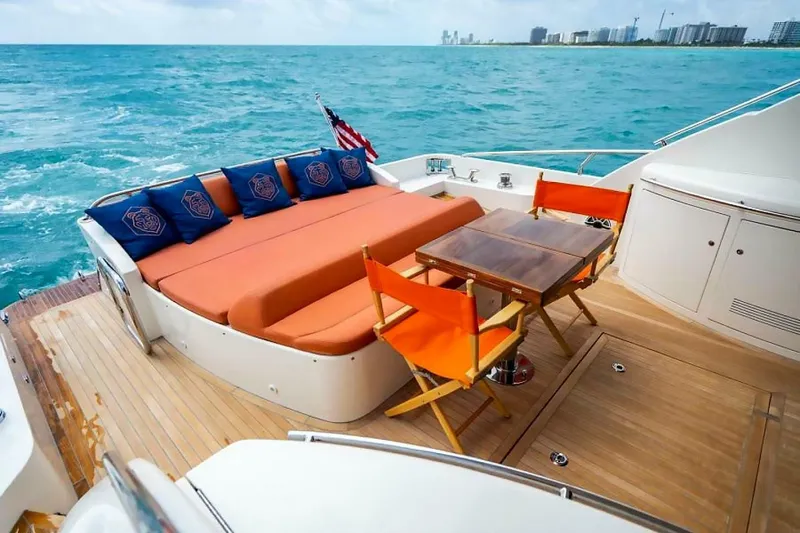 Slide: The Image of Luxurious 2009 Uniesse 68 Sport Yacht deck with seating and ocean view. - 11