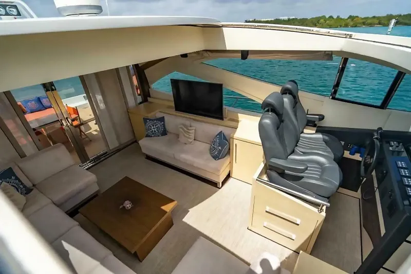 Slide: The Image of Luxurious interior of 2009 Uniesse 68 Sport Yacht with plush seating and modern helm. - 13