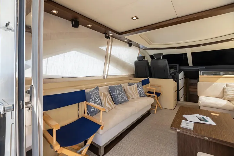 Slide: The Image of Luxurious interior of 2009 Uniesse 68 Sport Yacht with elegant seating and helm. - 14