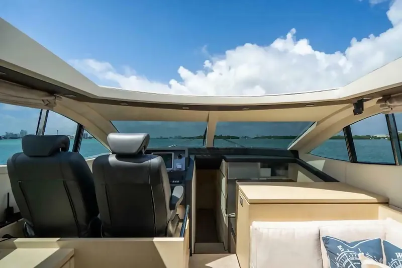 Slide: The Image of Interior view of 2009 Uniesse 68 Sport Yacht cockpit with ocean backdrop. - 19