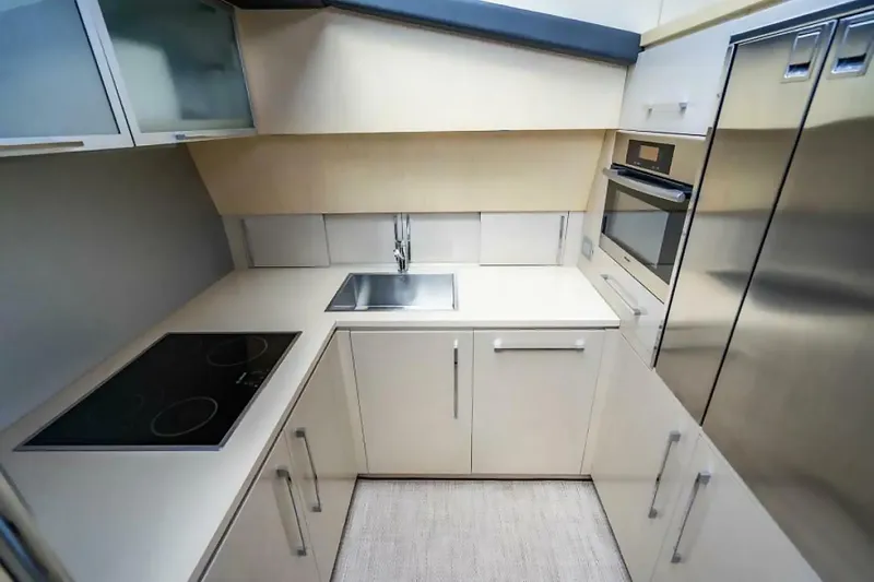 Slide: The Image of Modern kitchen in 2009 Uniesse 68 Sport Yacht with sleek appliances and minimalist design. - 23