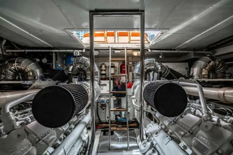 Slide: The Image of Engine room of 2009 Uniesse 68 Sport Yacht with dual engines and ladder access. - 35