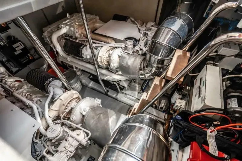 Slide: The Image of Engine room of 2009 Uniesse 68 Sport Yacht, showcasing mechanical components and systems. - 36
