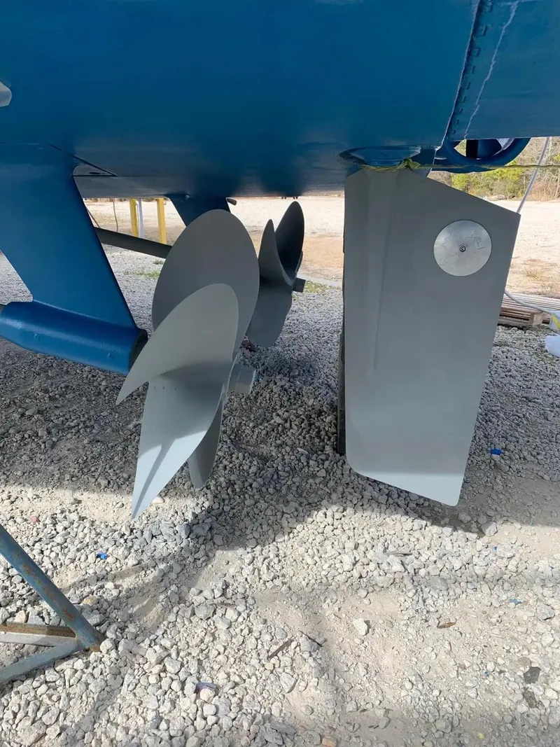Slide: The Image of Propellers and rudder of 2009 Uniesse 68 Sport Yacht on gravel surface. - 41