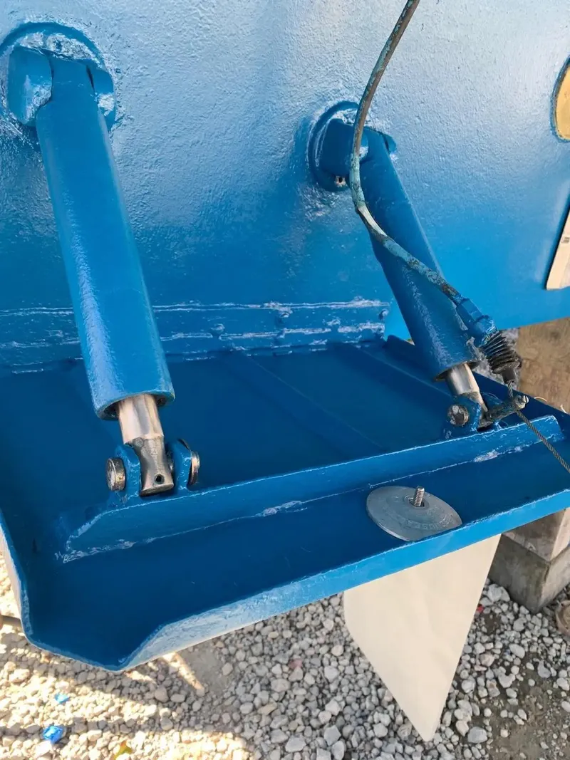 Slide: The Image of Close-up of hydraulic trim tabs on a 2009 Uniesse 68 Sport Yacht. - 42