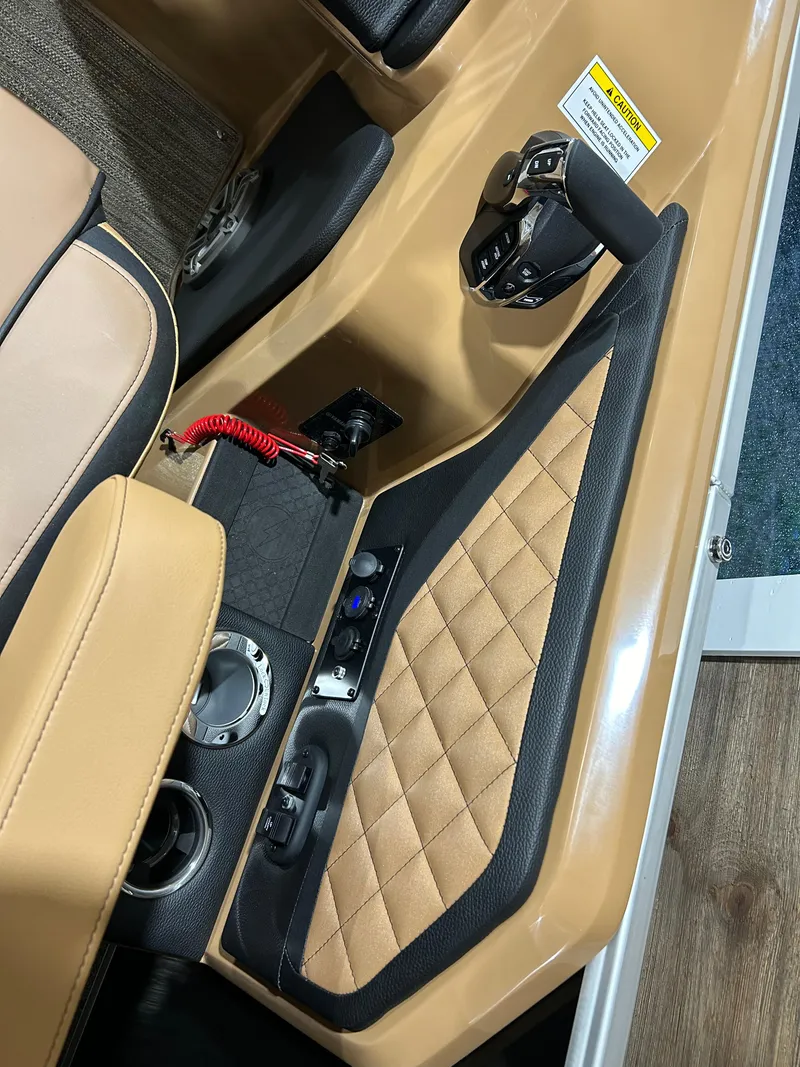 Slide: The Image of 2025 Godfrey Aqua Patio 235 ULC interior with tan leather and control panel. - 10