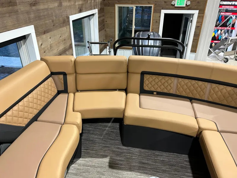 Slide: The Image of 2025 Godfrey Aqua Patio 235 ULC boat interior with tan leather seating. - 14