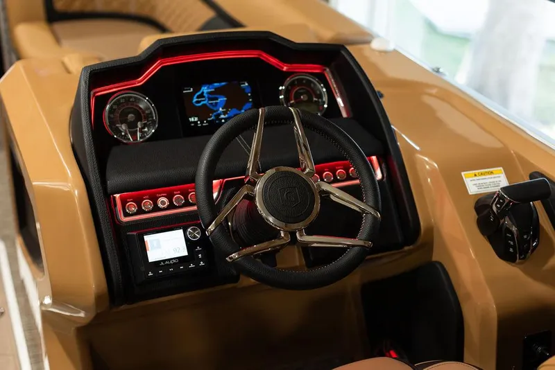 Slide: The Image of 2025 Godfrey Aqua Patio 235 ULC dashboard with modern steering wheel and digital display. - 21