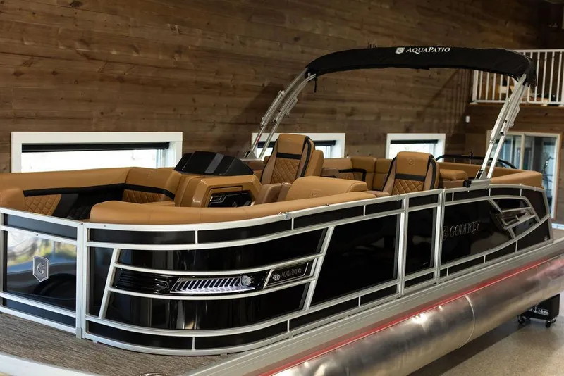 Slide: The Image of 2025 Godfrey Aqua Patio 235 ULC pontoon boat with luxurious seating and sleek design. - 28