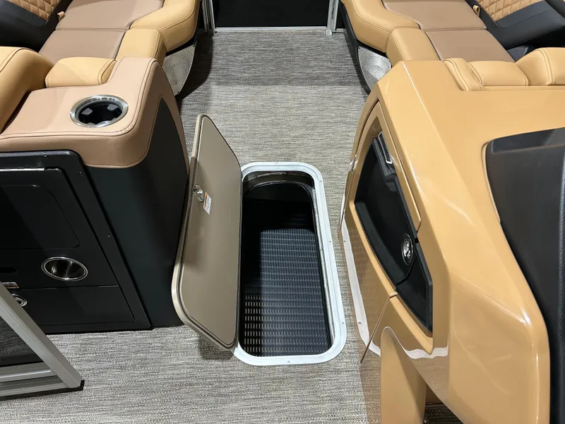 Slide: The Image of 2025 Godfrey Aqua Patio 235 ULC interior with open storage compartment and luxurious seating. - 6