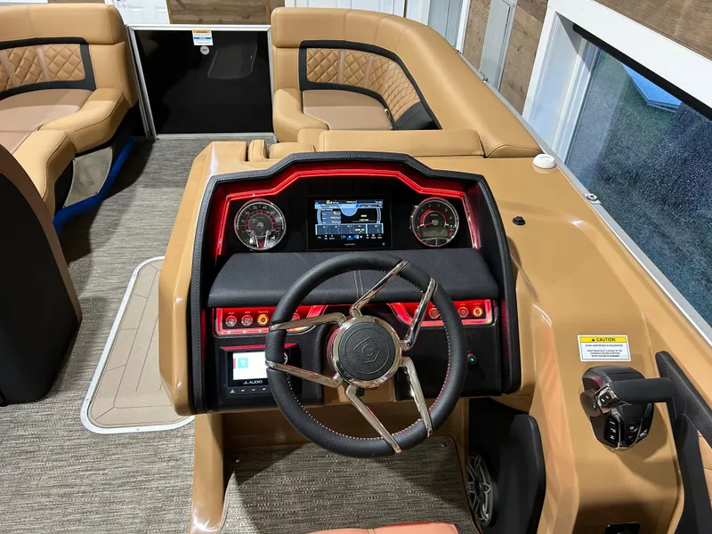 Slide: The Image of 2025 Godfrey Aqua Patio 235 ULC boat interior with modern dashboard and seating. - 7