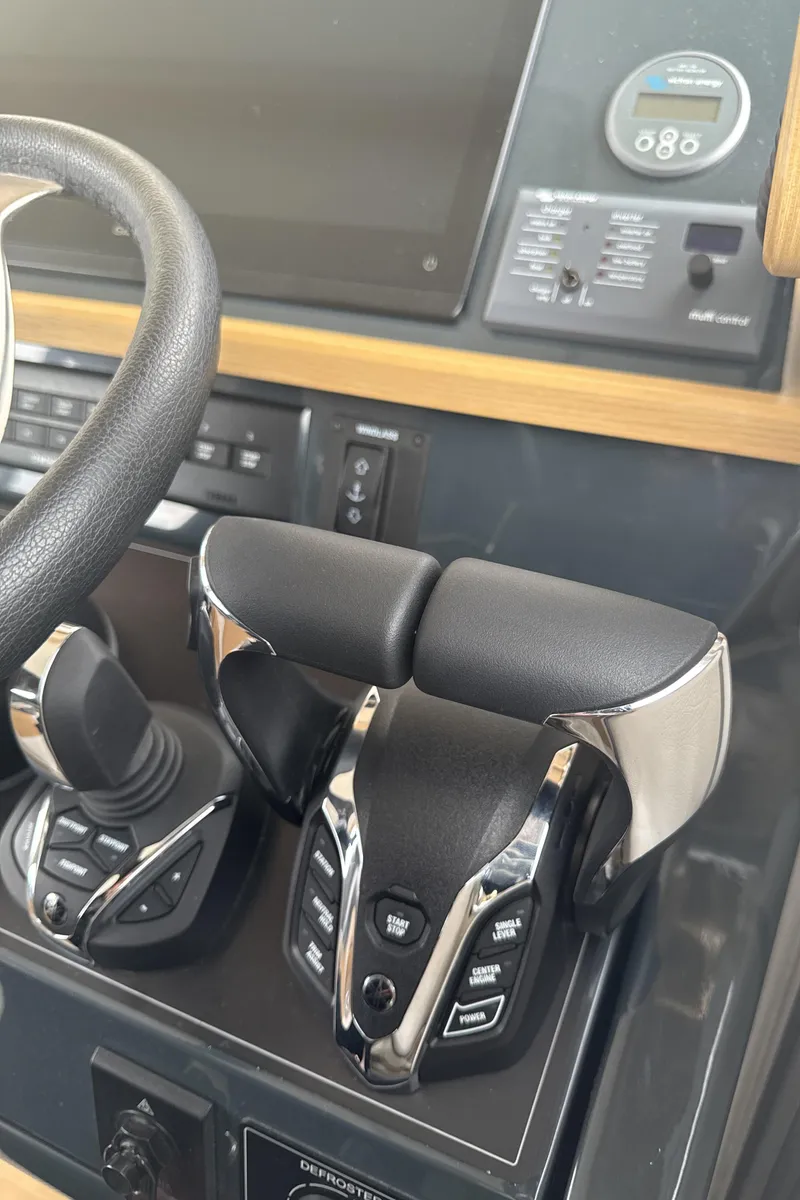 Slide: The Image of Control panel of 2025 Sargo 31OB boat with advanced throttle system. - 17