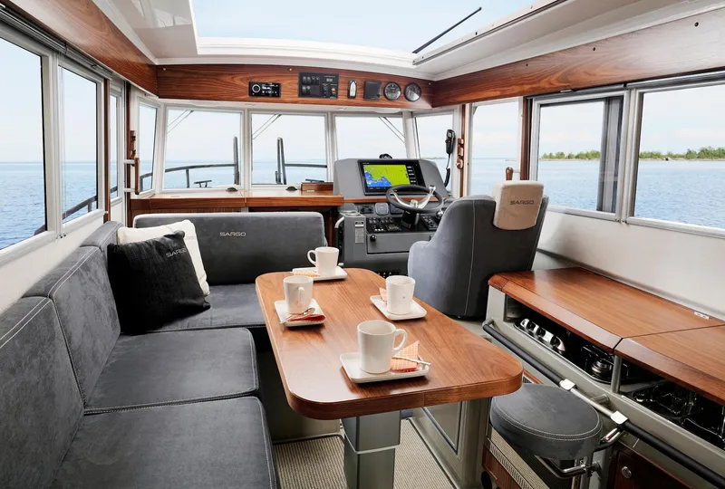 Slide: The Image of Interior of 2025 Sargo 31OB boat with modern seating and navigation equipment. - 31