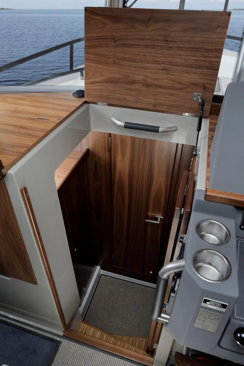 Slide: The Image of Interior of 2025 Sargo 31OB boat with wooden cabinetry and modern design. - 34