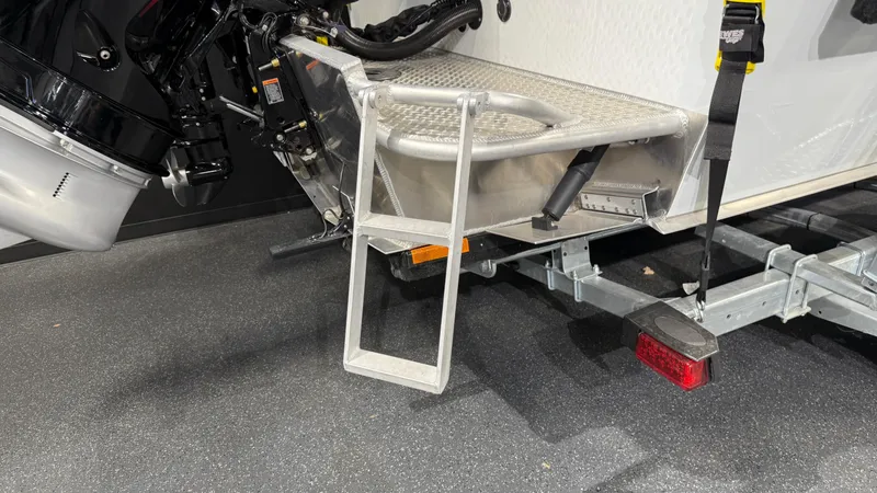 Slide: The Image of 2025 Hewescraft 240 Ocean Pro ET HT boat with ladder and trailer detail. - 10