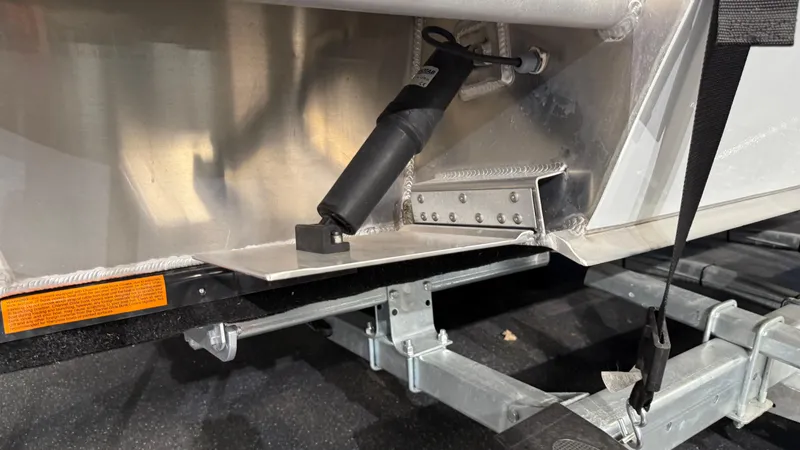 Slide: The Image of 2025 Hewescraft 240 Ocean Pro ET HT boat trailer detail, showing suspension and metal components. - 11