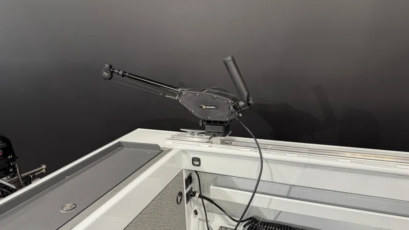 Slide: The Image of 2025 Hewescraft 240 Ocean Pro ET HT boat interior with mounted fishing rod holder. - 12