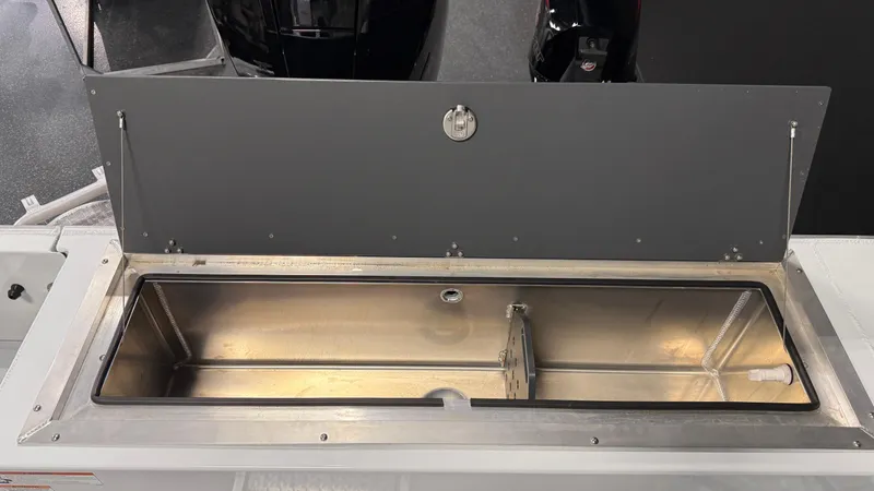 Slide: The Image of Open storage compartment on 2025 Hewescraft 240 Ocean Pro ET HT boat. - 15