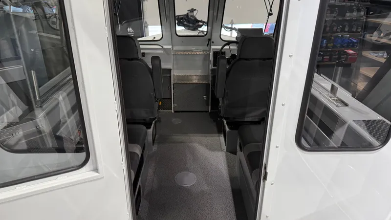 Slide: The Image of 2025 Hewescraft 240 Ocean Pro ET HT interior with seating and helm, showcasing modern design. - 20