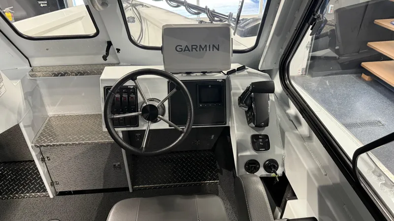 Slide: The Image of 2025 Hewescraft 240 Ocean Pro ET HT boat interior with Garmin navigation system. - 21