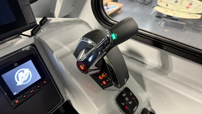 Slide: The Image of Control panel of 2025 Hewescraft 240 Ocean Pro ET HT boat cockpit. - 26